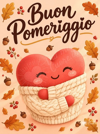 Cuore con maglioncino di lana tra foglie autunnali per il buon pomeriggio.